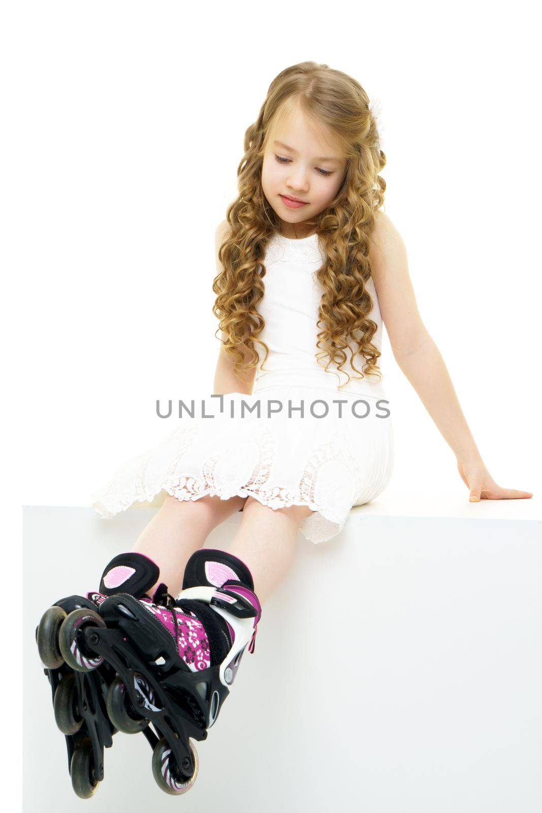 Little girl on roller skates. by kolesnikov_studio