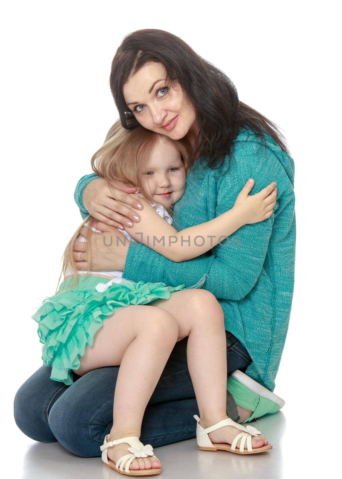 Happy little girl clung to my beloved mother - Isolated on white background