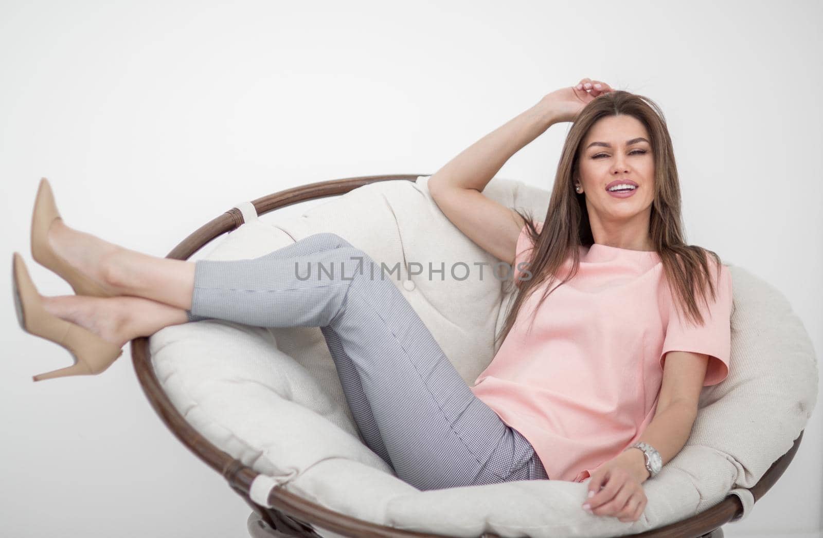 beautiful young woman sitting in comfortable chair.photo with copy space