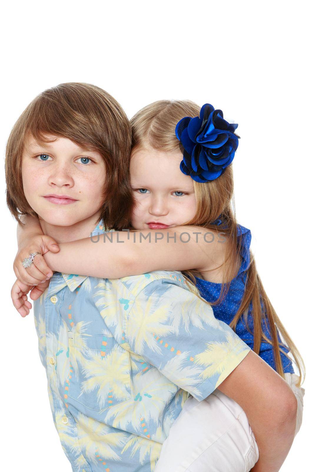 Beautiful little girl hugging his neck of his older brother. Close-up-Isolated on white background