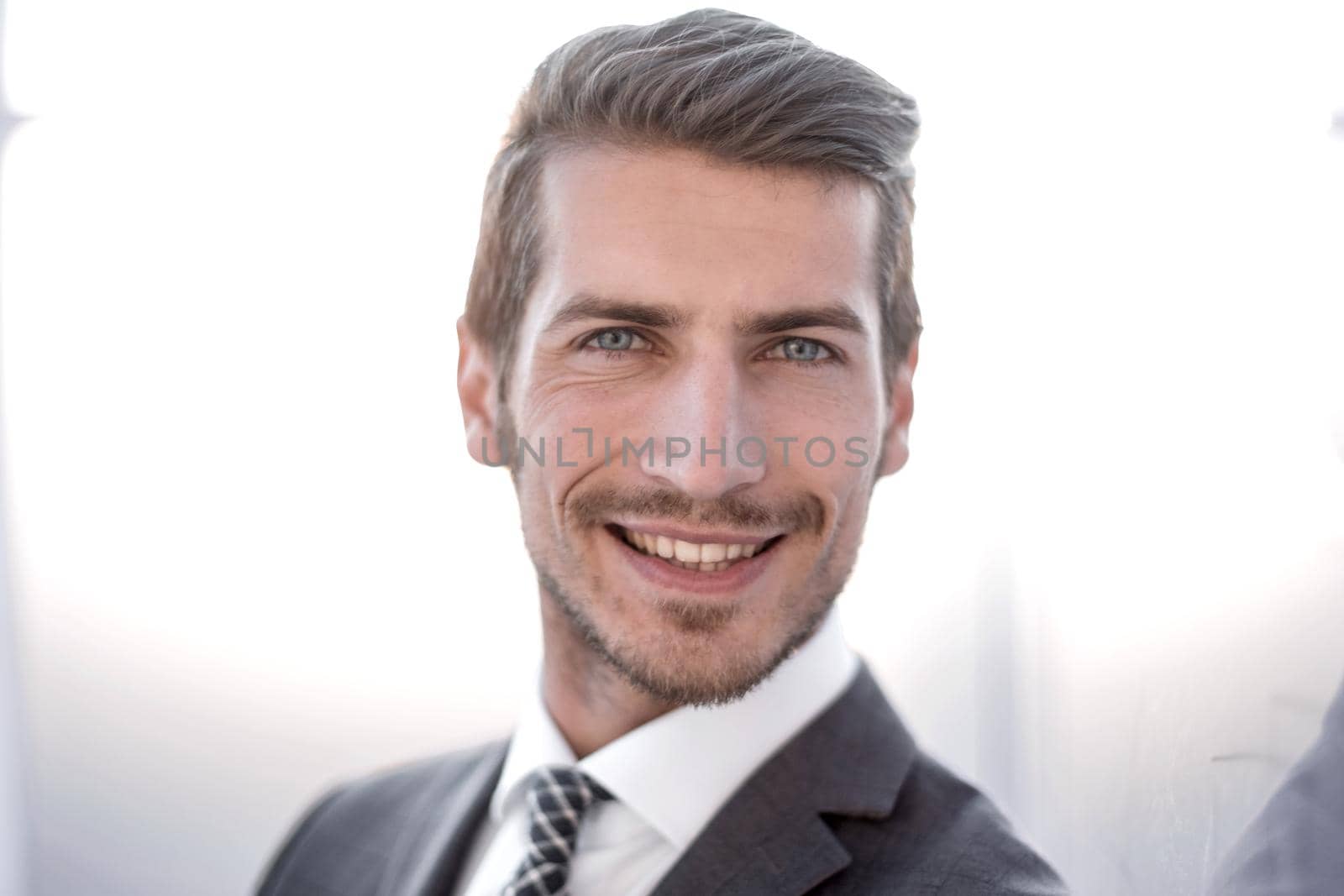 close up.portrait of a young businessman on a blurred background.