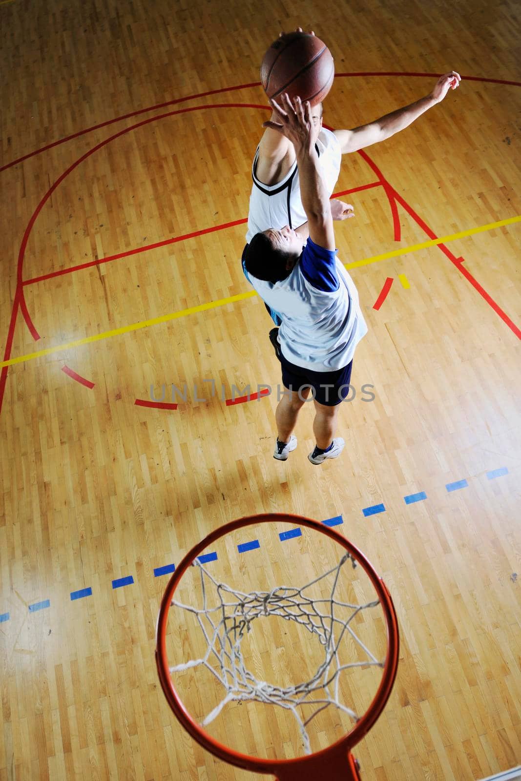 competition cencept with people who playing and exercise  basketball sport  in school gym