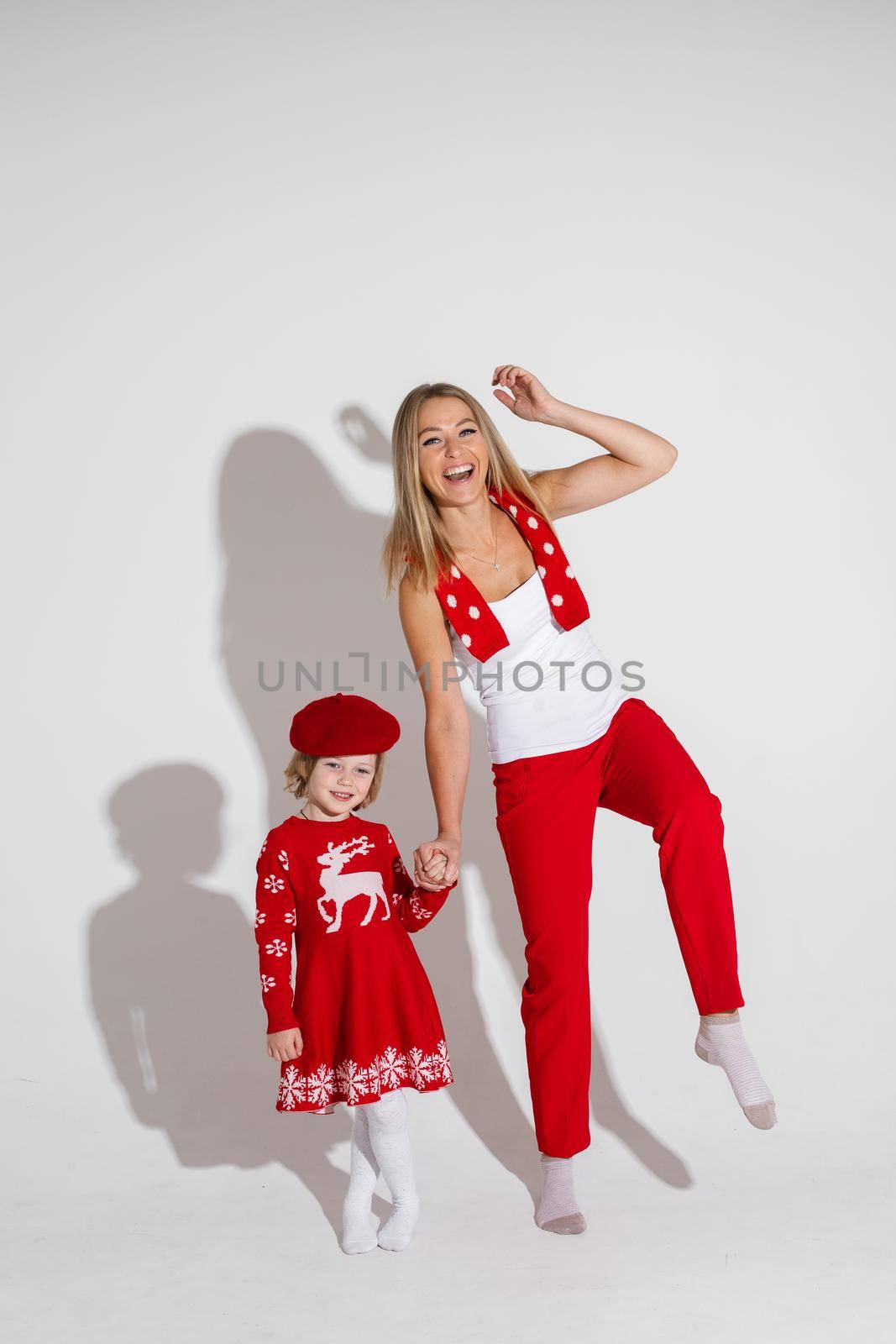 young mum rejoices with her daughter , picture isolated on white background by StudioLucky