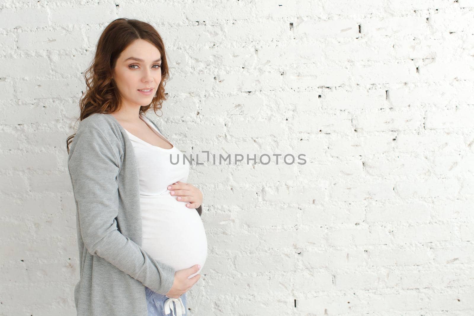 Pregnant female posing looking at camera by Demkat