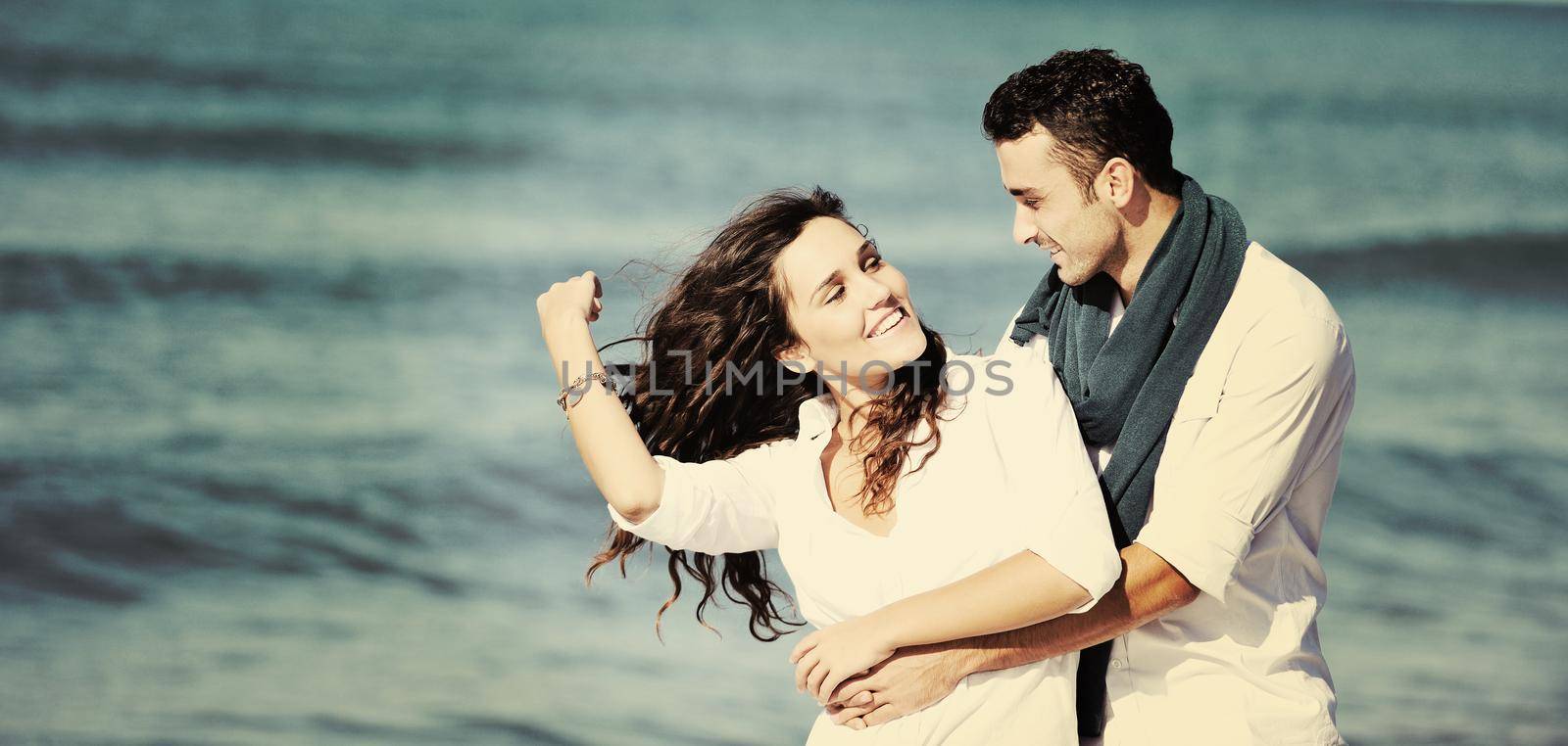 happy young couple in white clothing  have romantic recreation and   fun at beautiful beach on  vacations