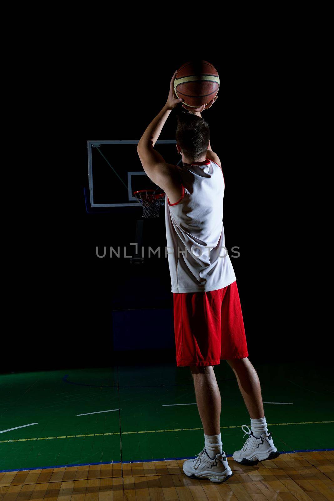 basketball game sport player in action isolated on black background