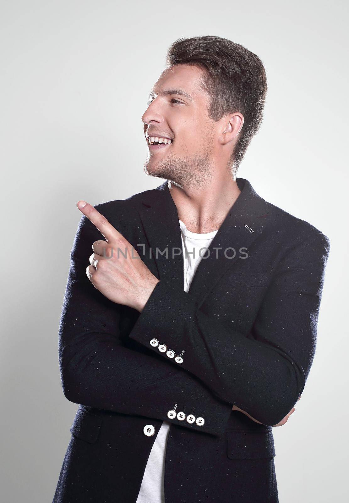 Attractive young man in suit pointing up with his finger isolate by asdf