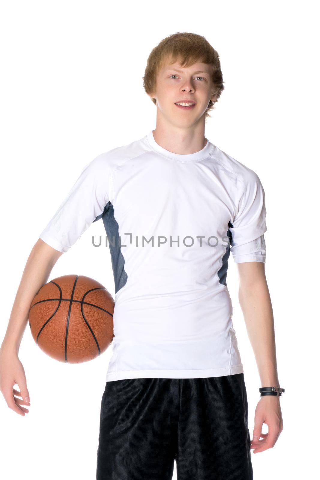 A young red-haired guy playing basketball. The concept of sport, fitness, healthy lifestyle. Isolated on white background.