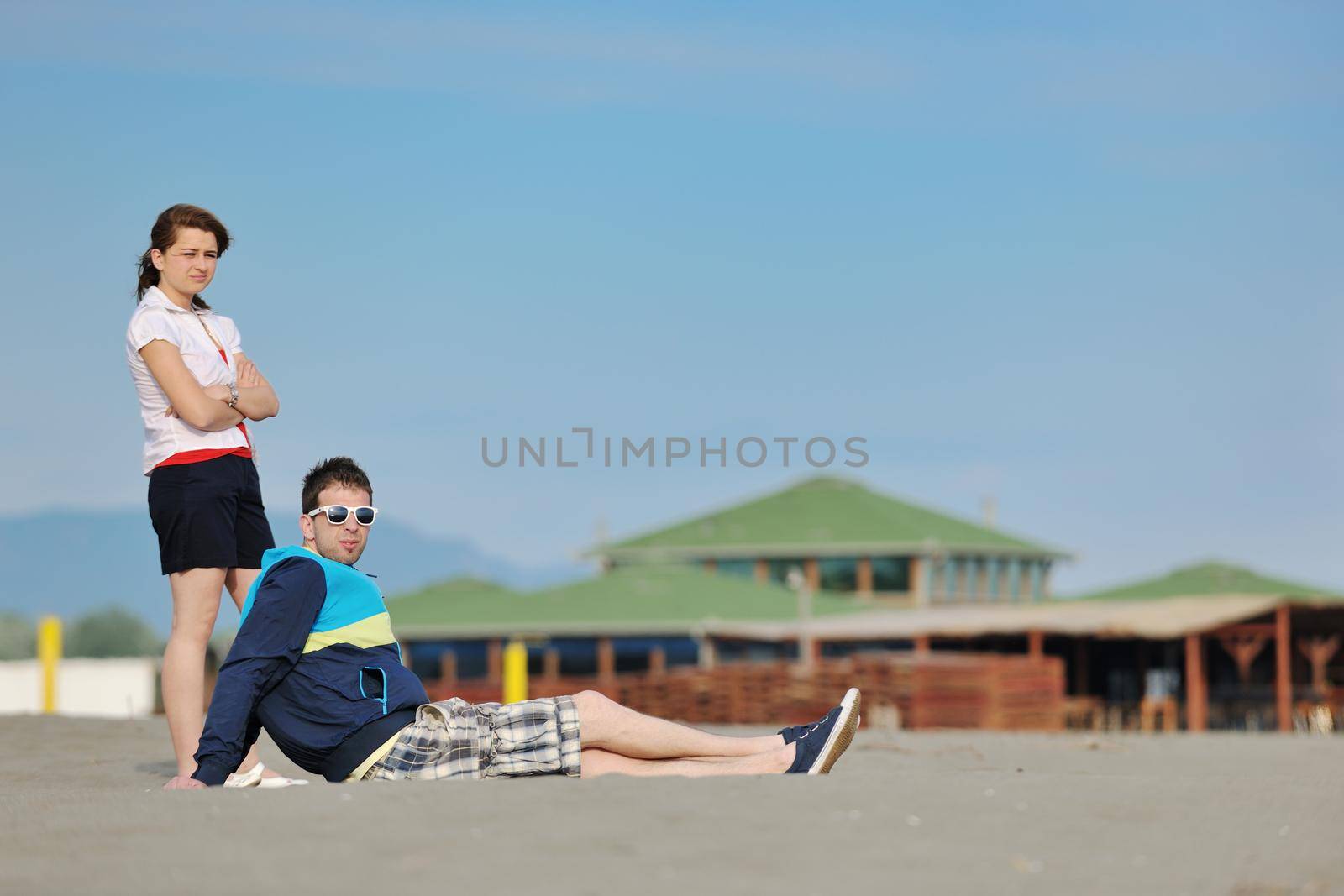 happy young couple have fun and romantic moments on beach at summer season and representing happynes and travel concept