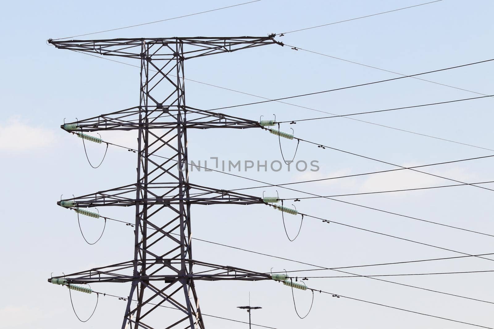 High voltage insulated overhead electrical power pylon with power lines