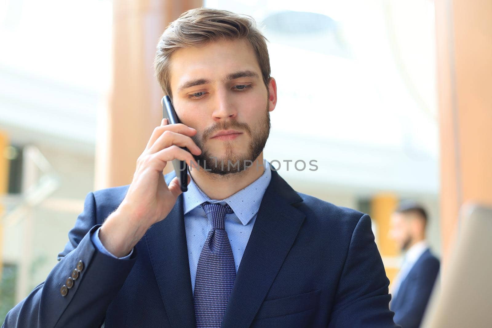 Businessman using his mobile phone in the office