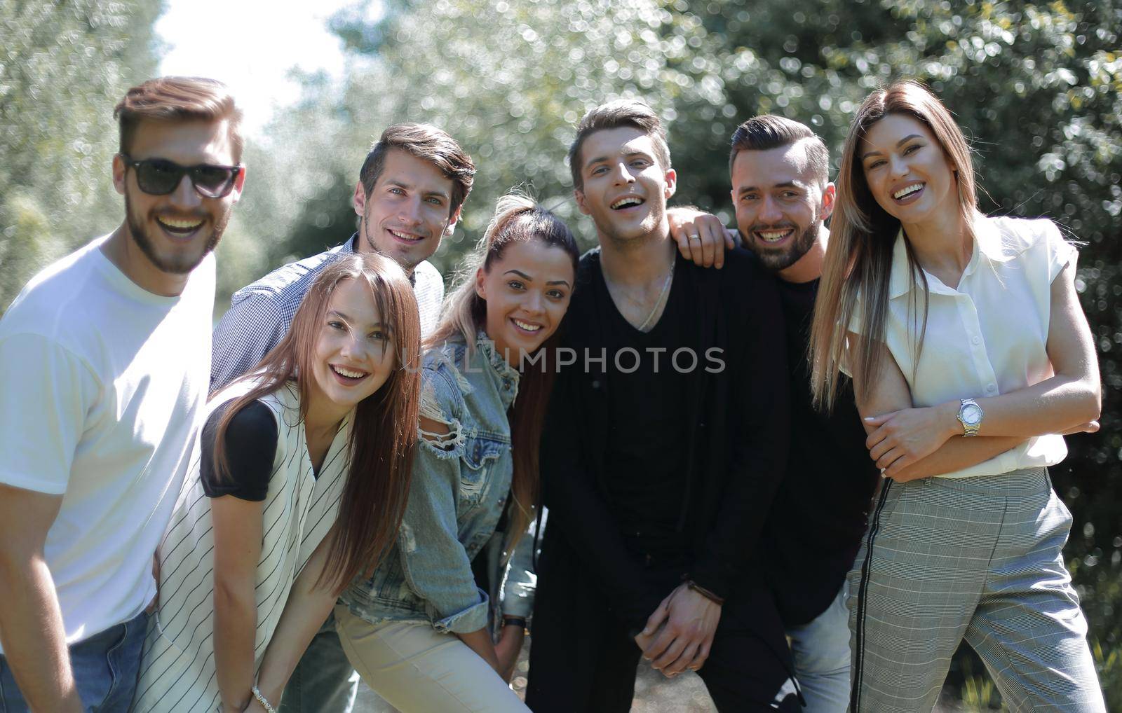 group of creative youth on the background of the Park. the concept of friendship