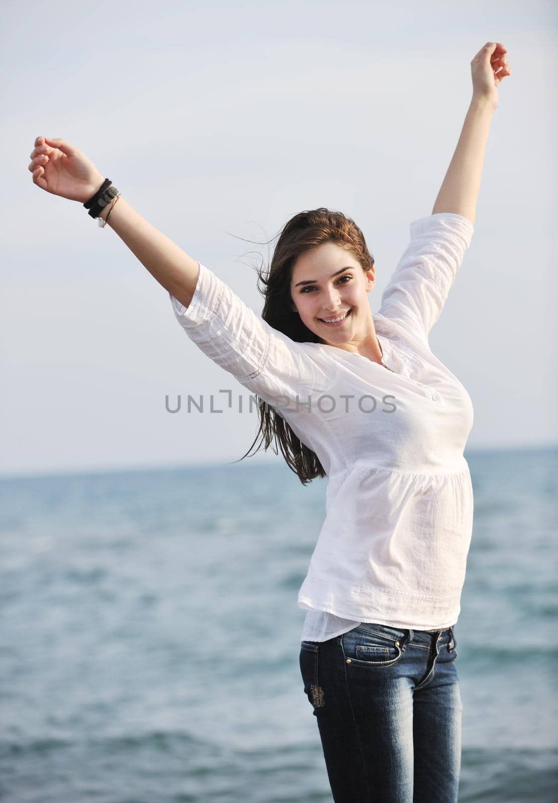 young woman enjoy on beach by dotshock