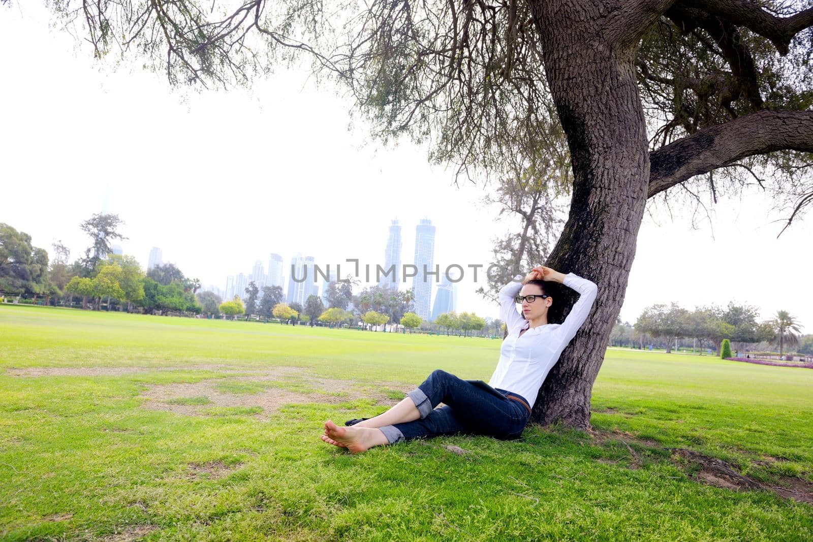 Beautiful young student  woman study with tablet in park