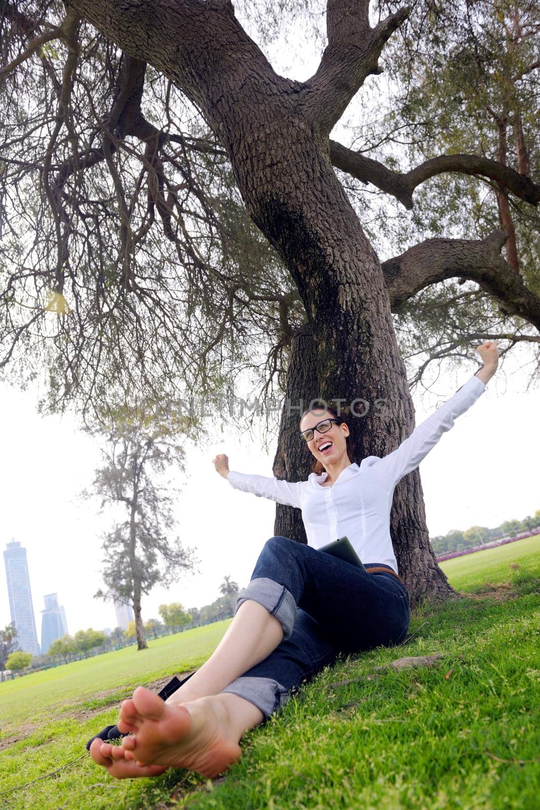 Beautiful young student  woman study with tablet in park