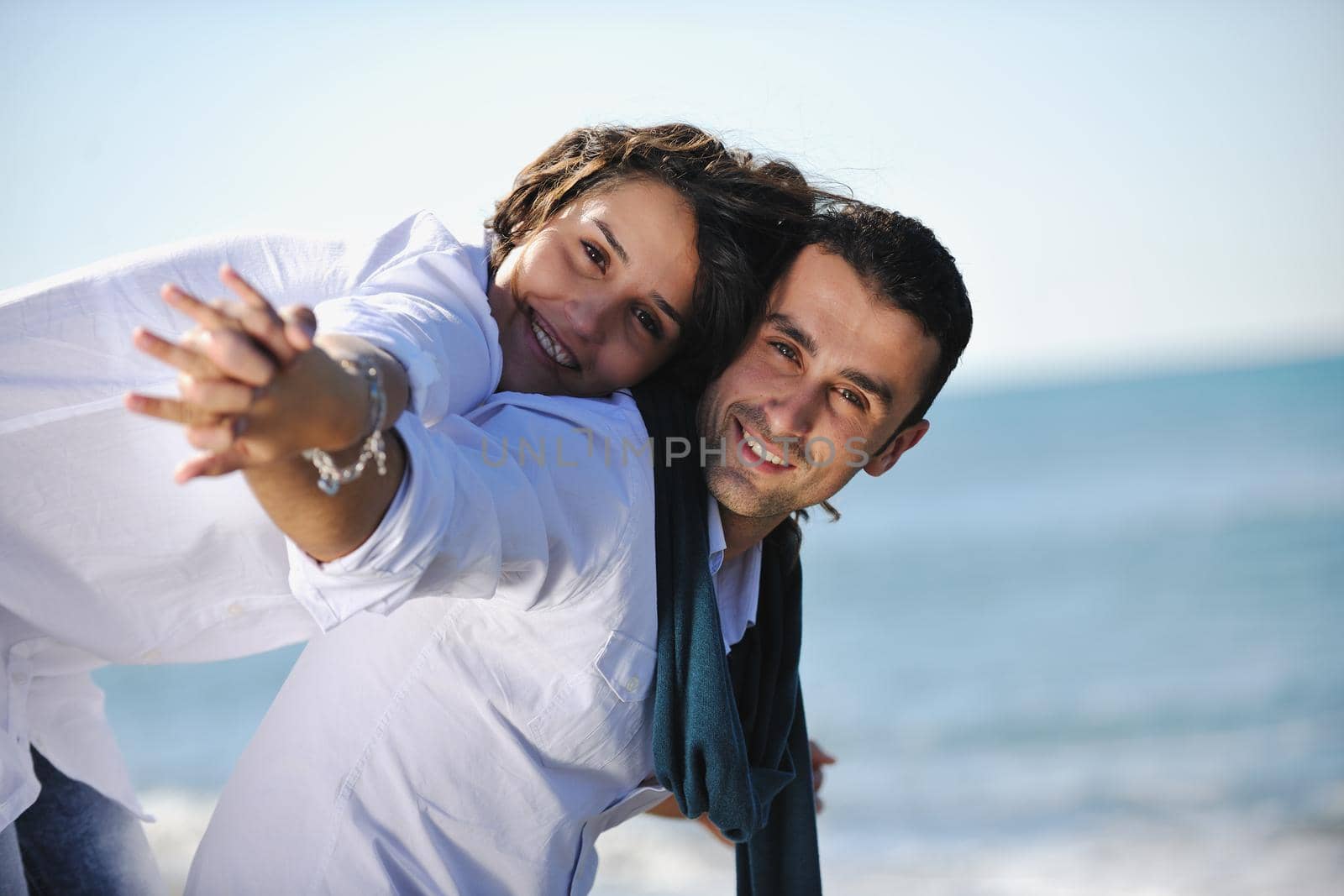 happy young couple in white clothing  have romantic recreation and   fun at beautiful beach on  vacations