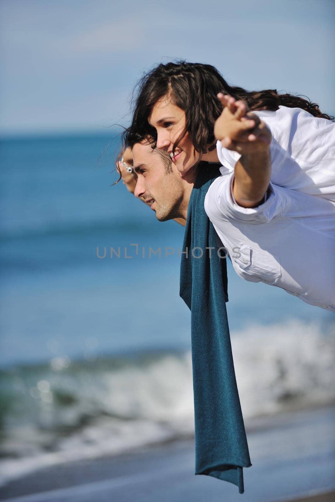 happy young couple in white clothing  have romantic recreation and   fun at beautiful beach on  vacations