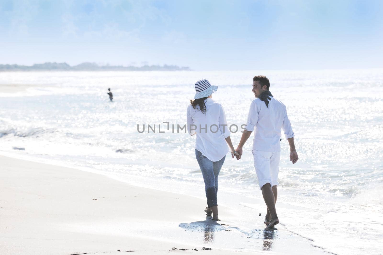 happy young couple in white clothing  have romantic recreation and   fun at beautiful beach on  vacations