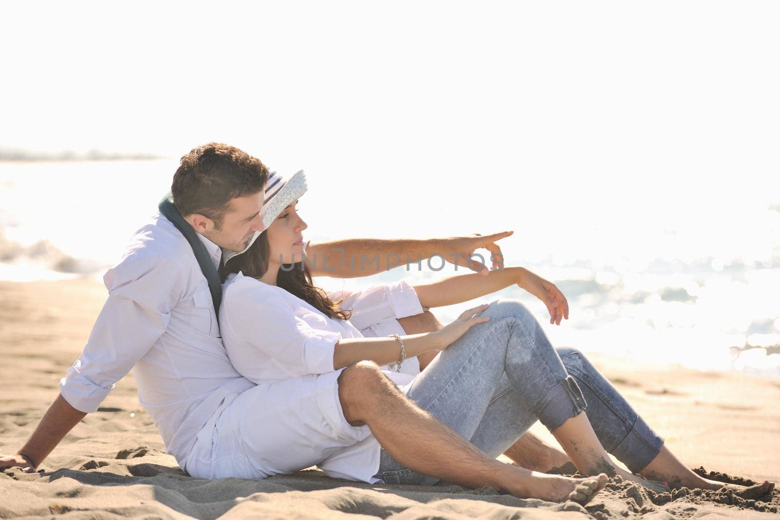 happy young couple in white clothing  have romantic recreation and   fun at beautiful beach on  vacations