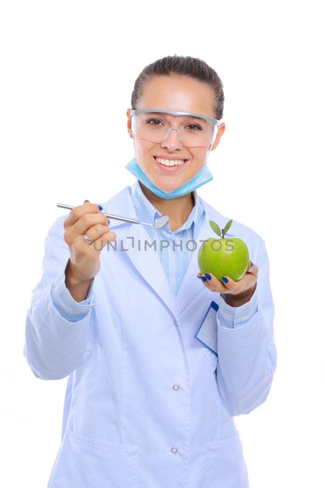 Dentist medical doctor woman hold green fresh apple in hand and tooth brush. Dentist doctors. Woman doctors.