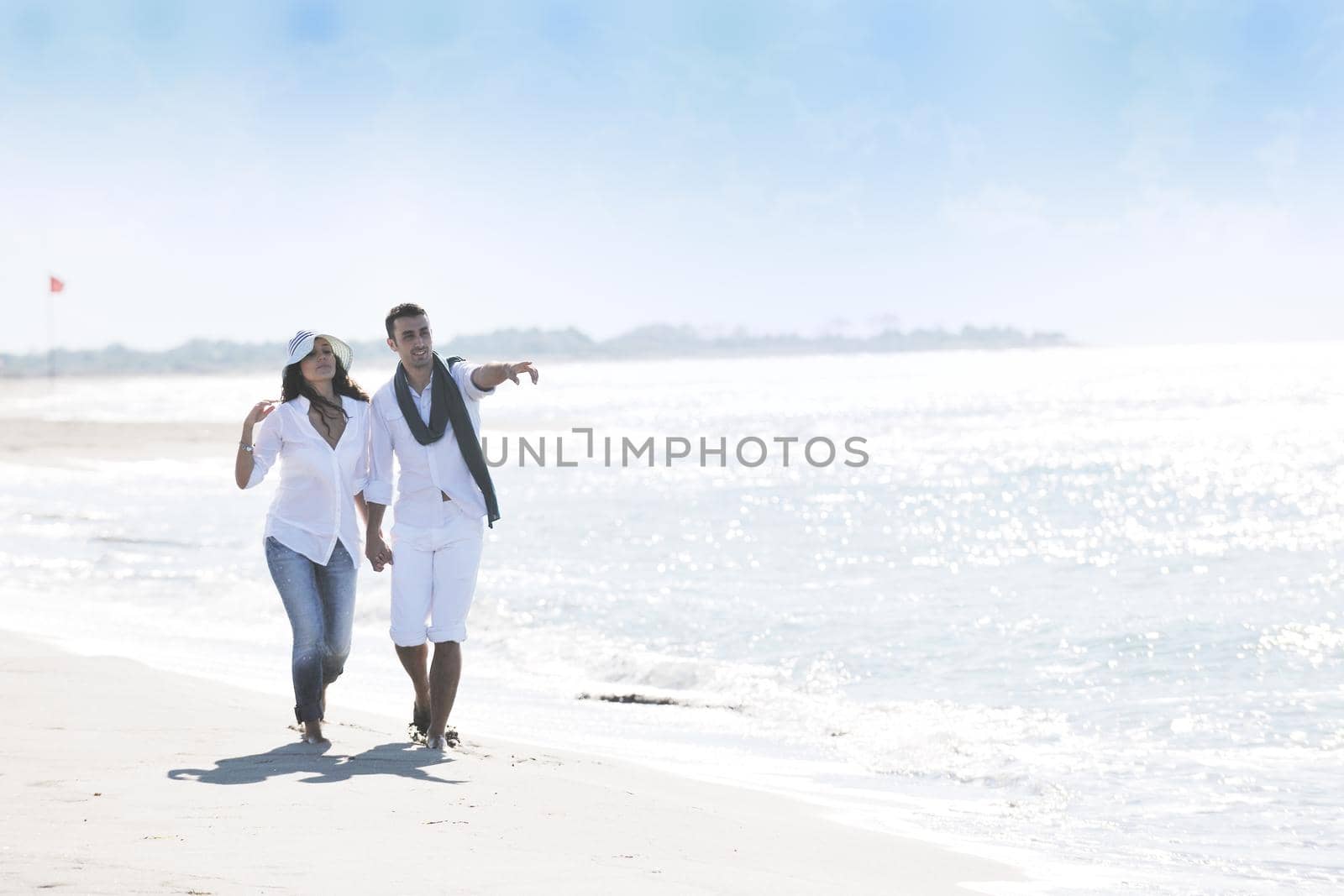 happy young couple in white clothing  have romantic recreation and   fun at beautiful beach on  vacations