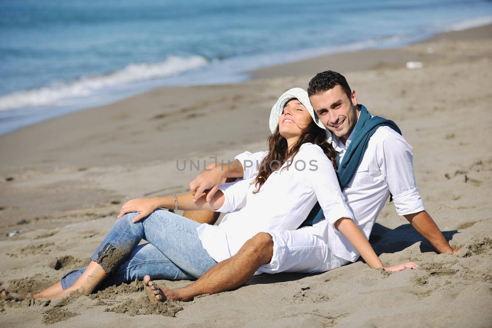 happy young couple in white clothing  have romantic recreation and   fun at beautiful beach on  vacations