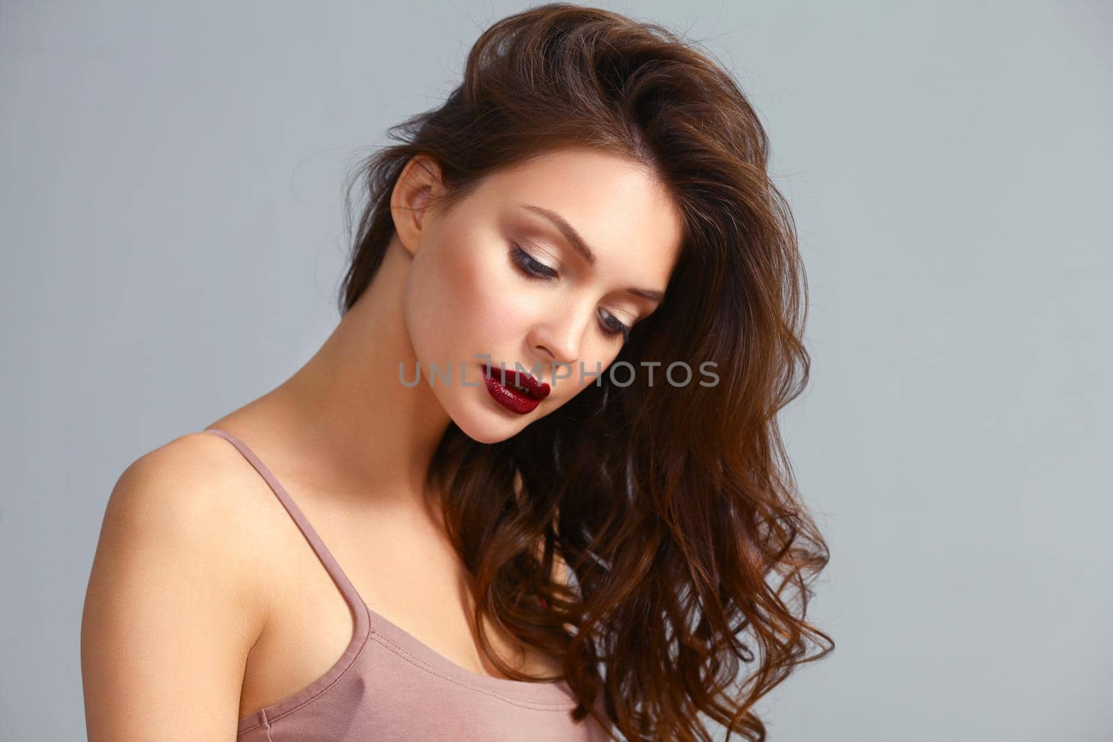 Portrait of beautiful woman , isolated on gray background.