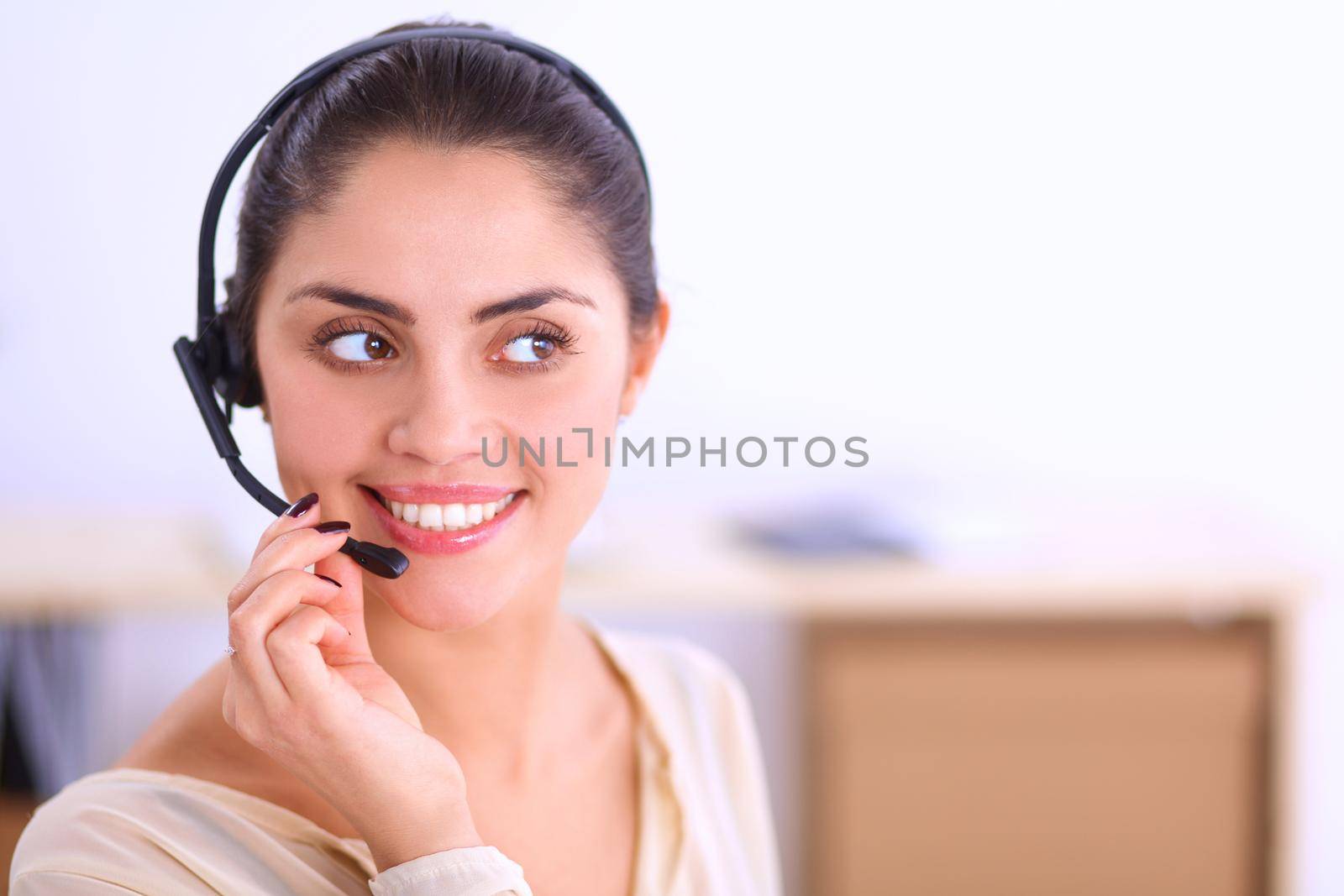 portrait of a customer service agent sitting at office