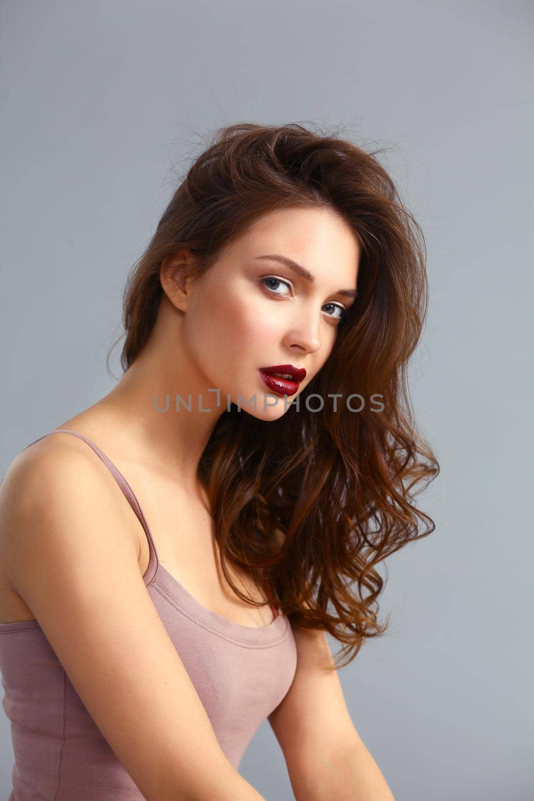 Portrait of beautiful woman , isolated on gray background.