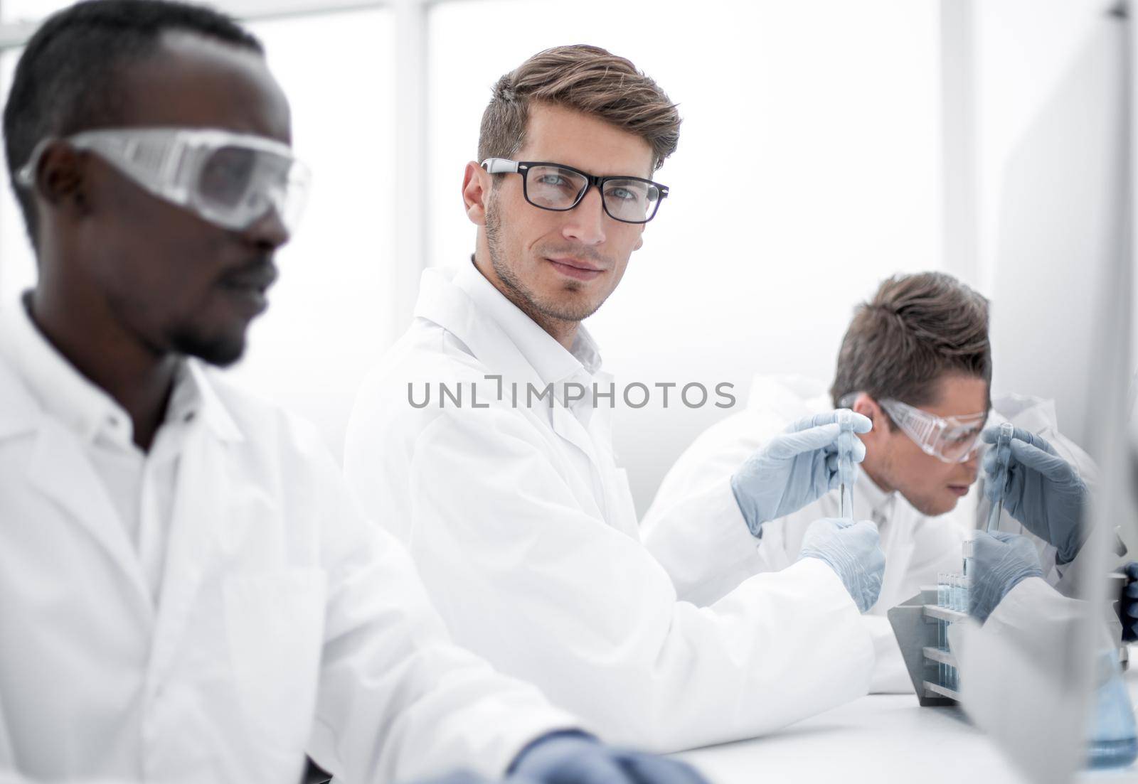 promising scientist working on a computer in the laboratory.science and technology