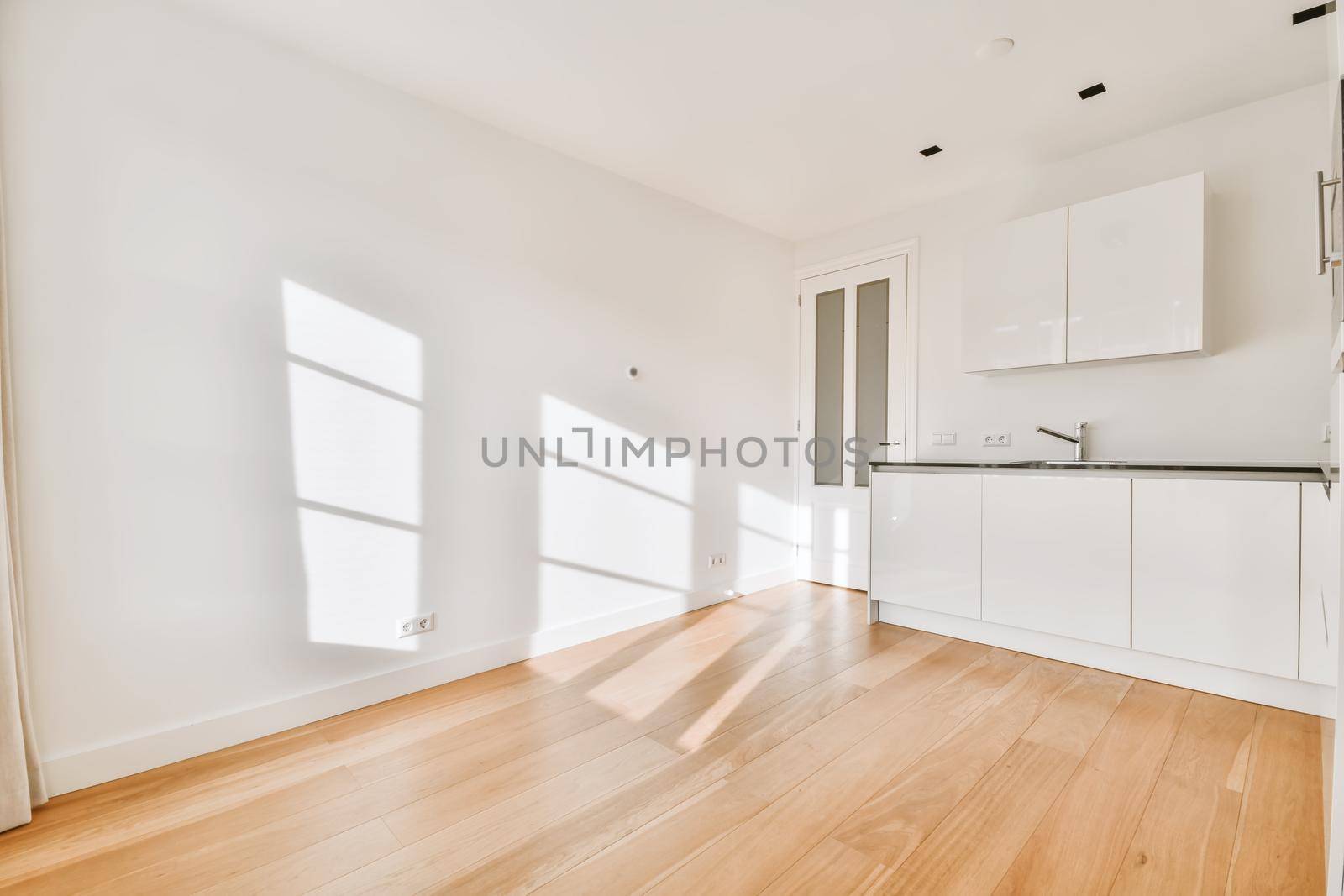 Lovely kitchen with white walls and kitchen set