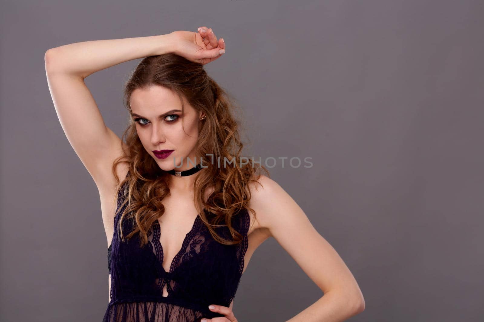 Close up portrait of beautiful young woman face. Isolated on gray background. by lenetstan