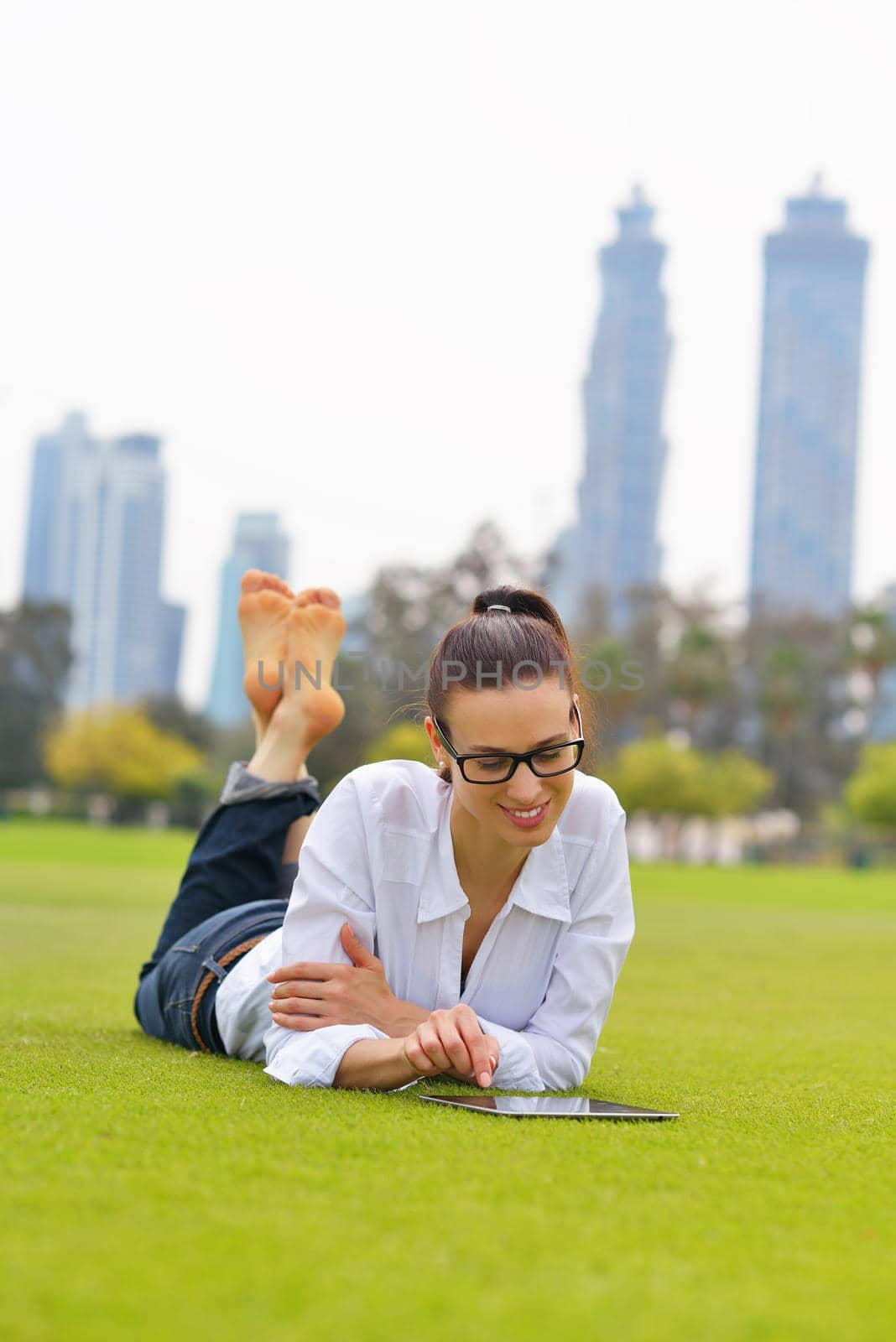 Beautiful young student  woman study with tablet in park