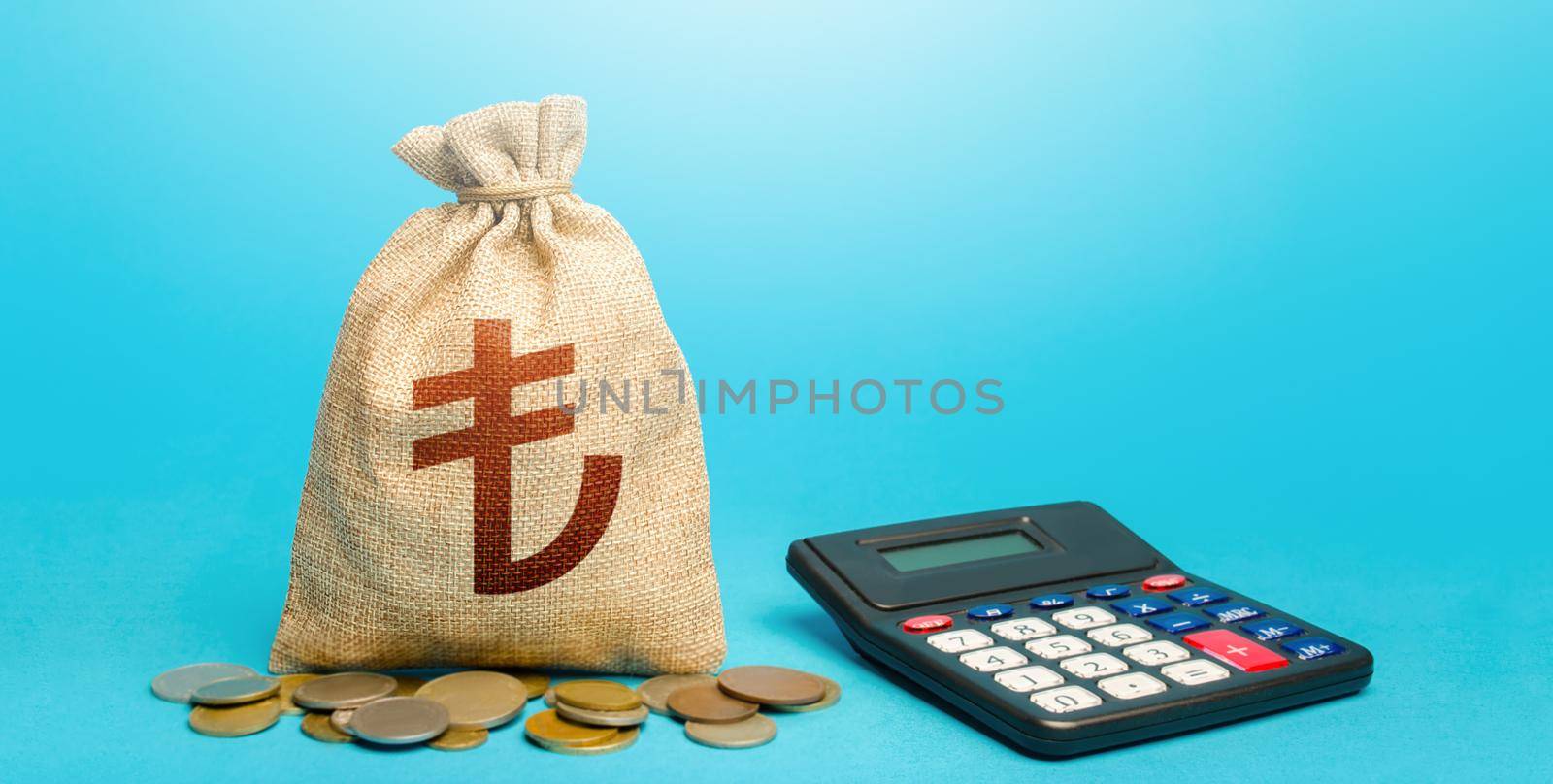 Turkish lira money bag and calculator. Accounting concept. Analysis of loan selection. Income and expenses. Summing up the financial results. Budgeting. Calculation of damage and insurance payments.