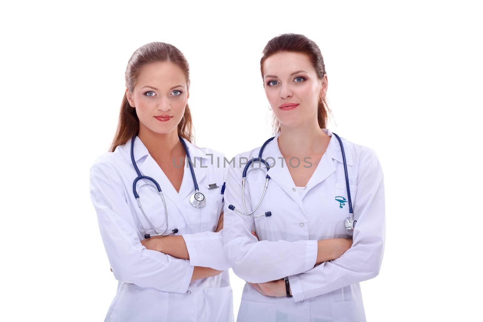 Two woman nurse watching X Ray image, standing in hospital.