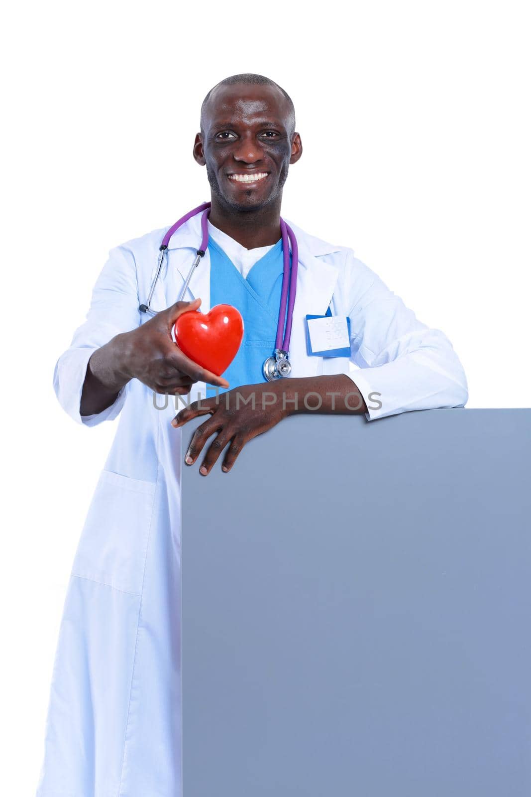 Male doctor with red heart and blank sign isolated on white background. Doctor. White background.