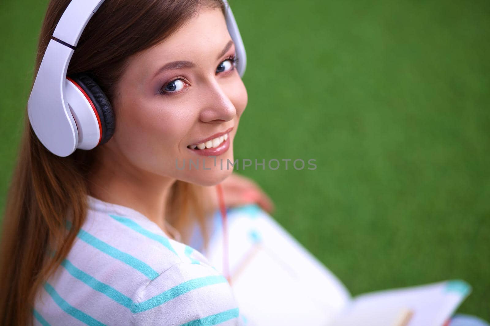 Young woman listening to the music .