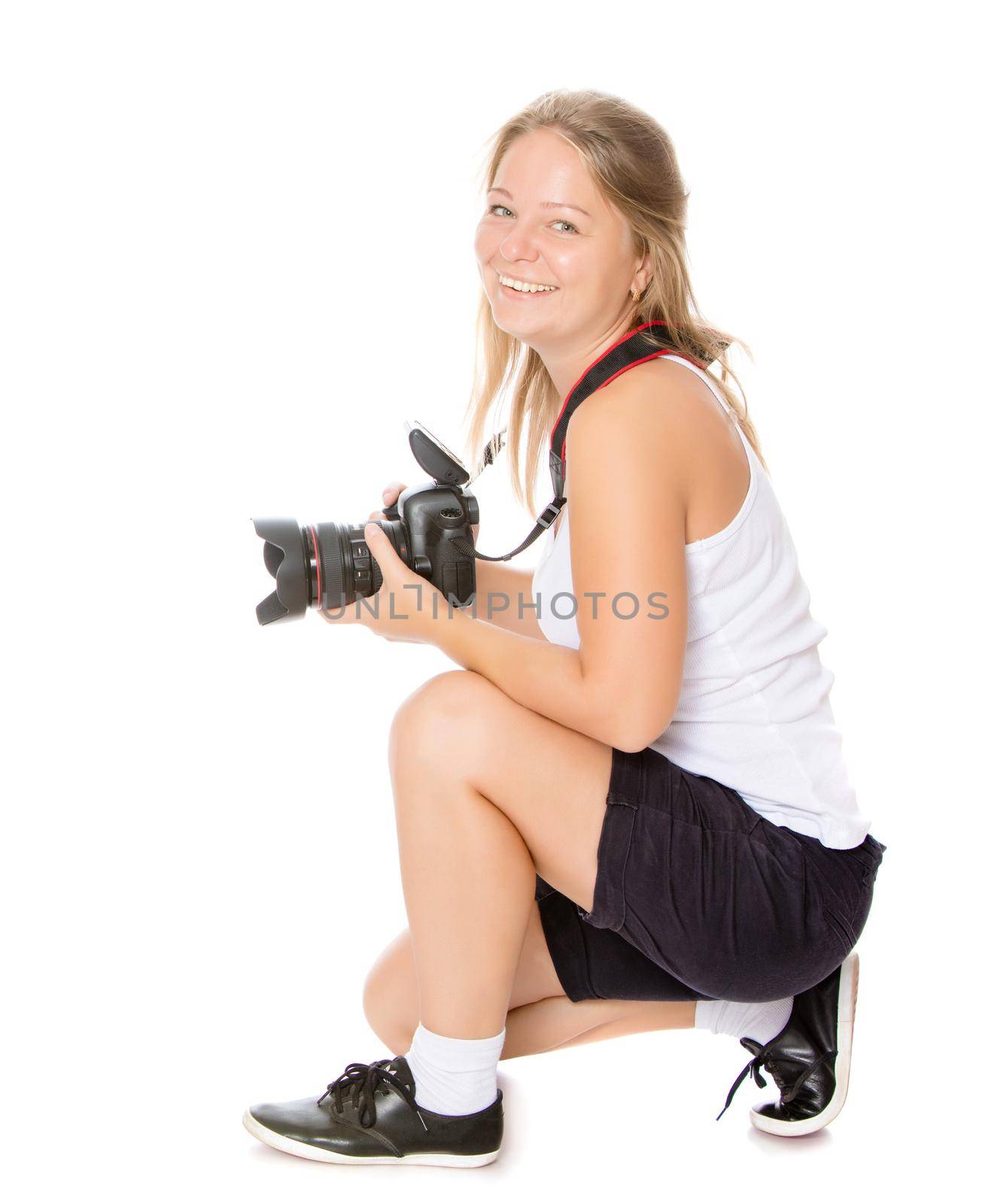 Cute young girl in white shirt drawing,with a professional camera.Isolated on white background