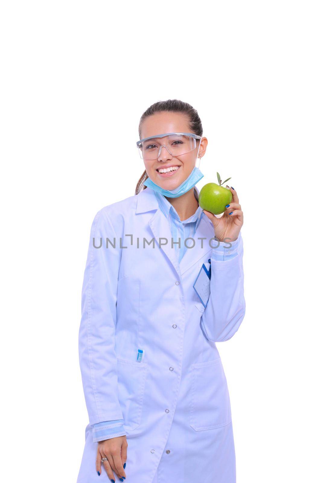 Dentist medical doctor woman hold green fresh apple in hand and tooth brush. Dentist doctors. Woman doctors.