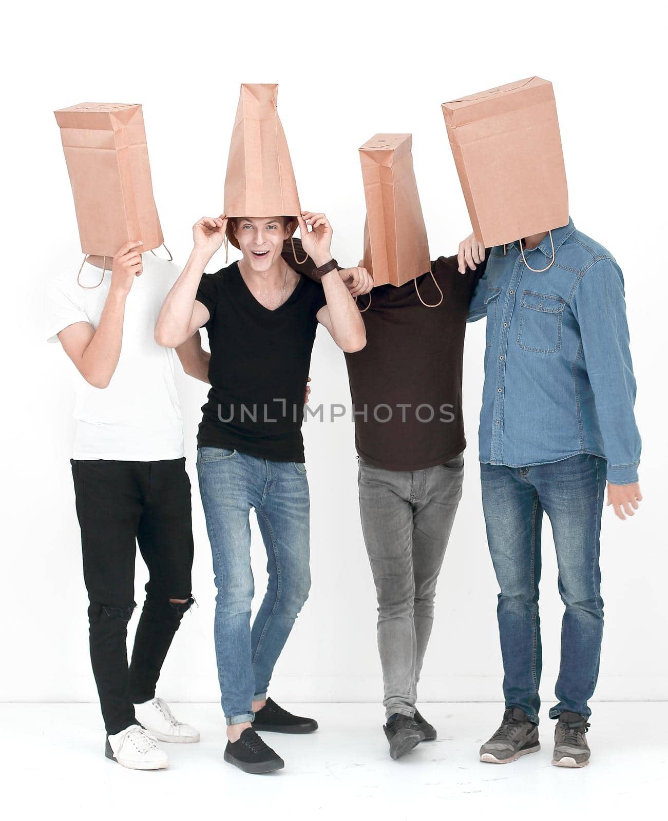 group of young people with paper bags on their heads by asdf