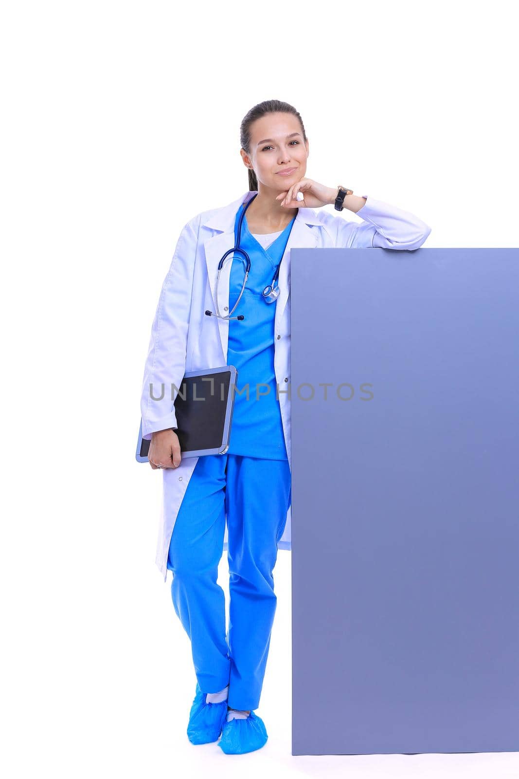 A female doctor with a blank billboard. Woman doctor.