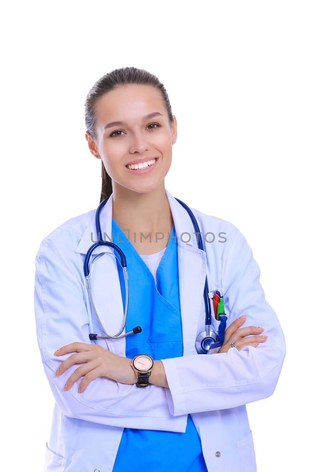Beautiful young woman in white coat posing with hand in pocket. Woman doctor by lenetstan