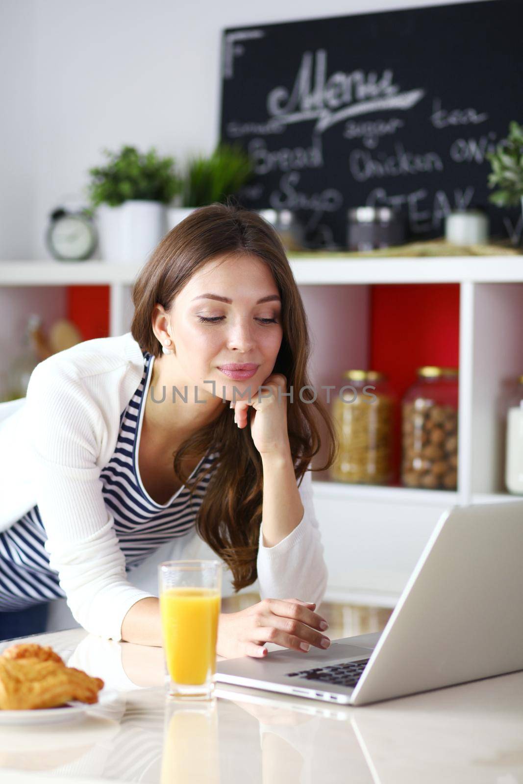 Portrait of a pretty woman holding glass with tasty juice . Portrait of a pretty woman.