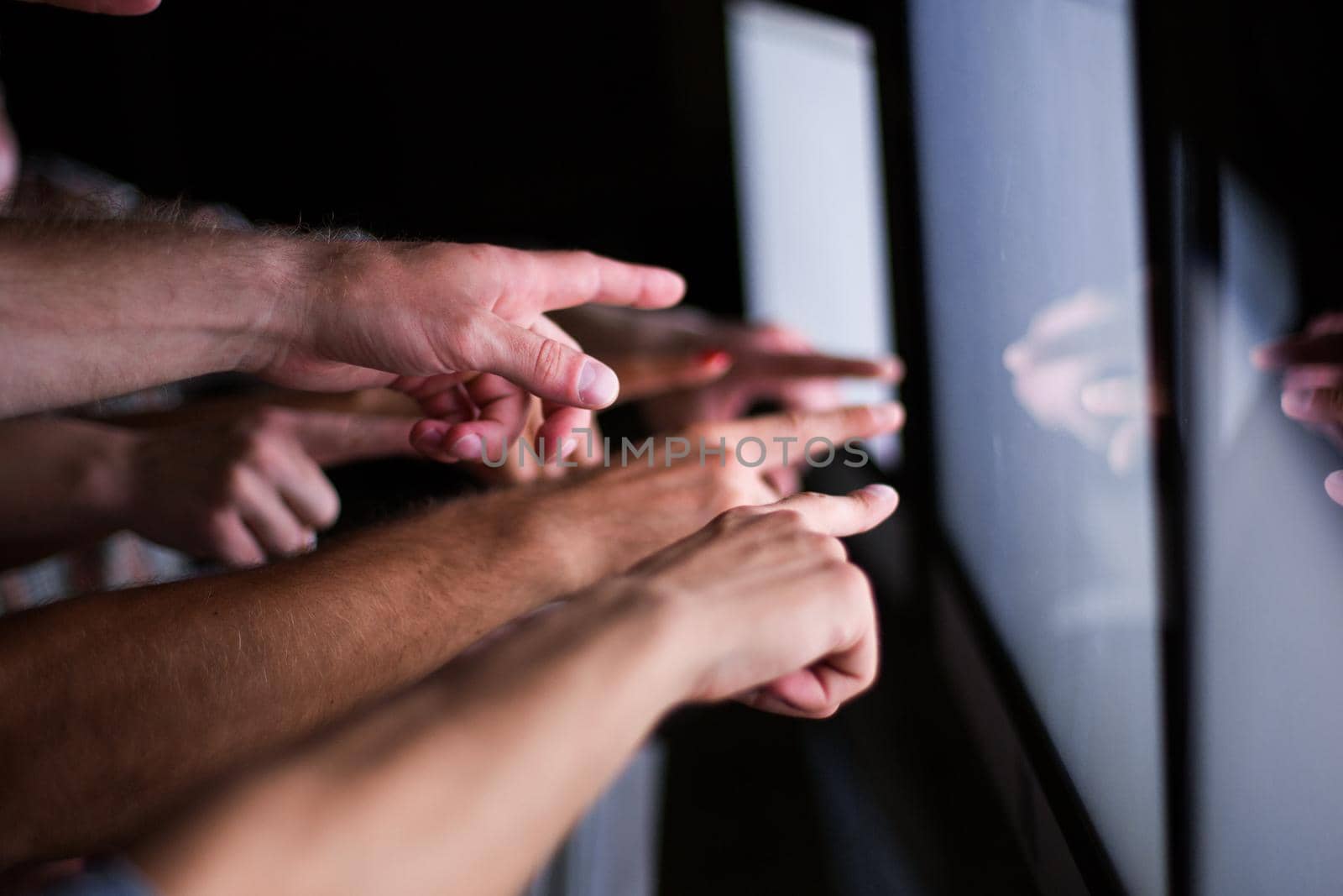 business team pointing their fingers at the computer screen .photo with copy space