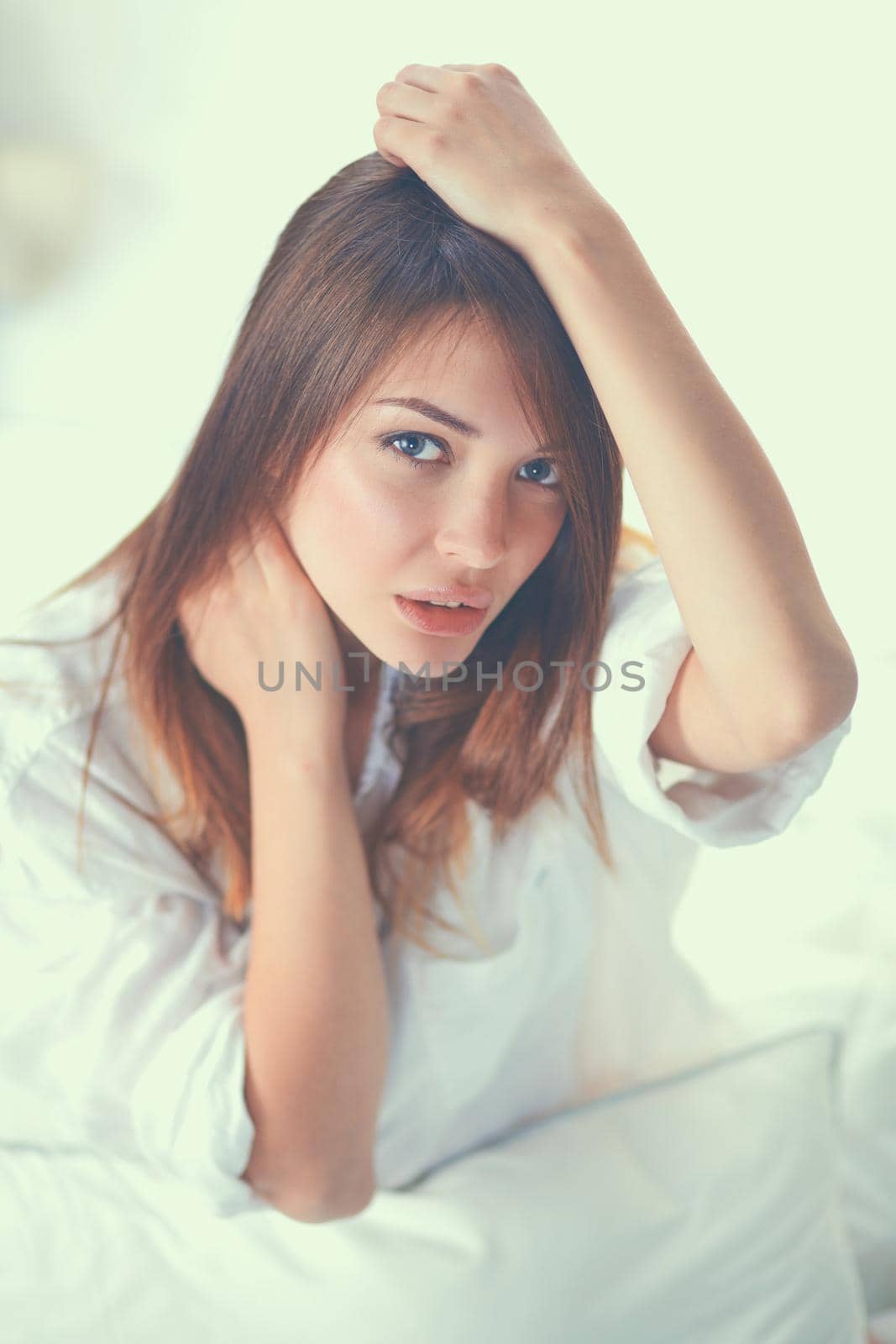 Portrait of beautiful woman on bed at bedroom by lenetstan