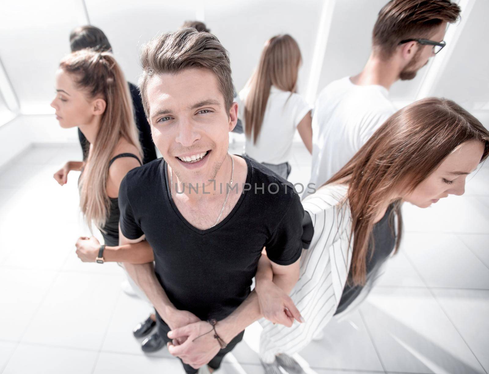 guy standing in a circle with his team .the concept of team building