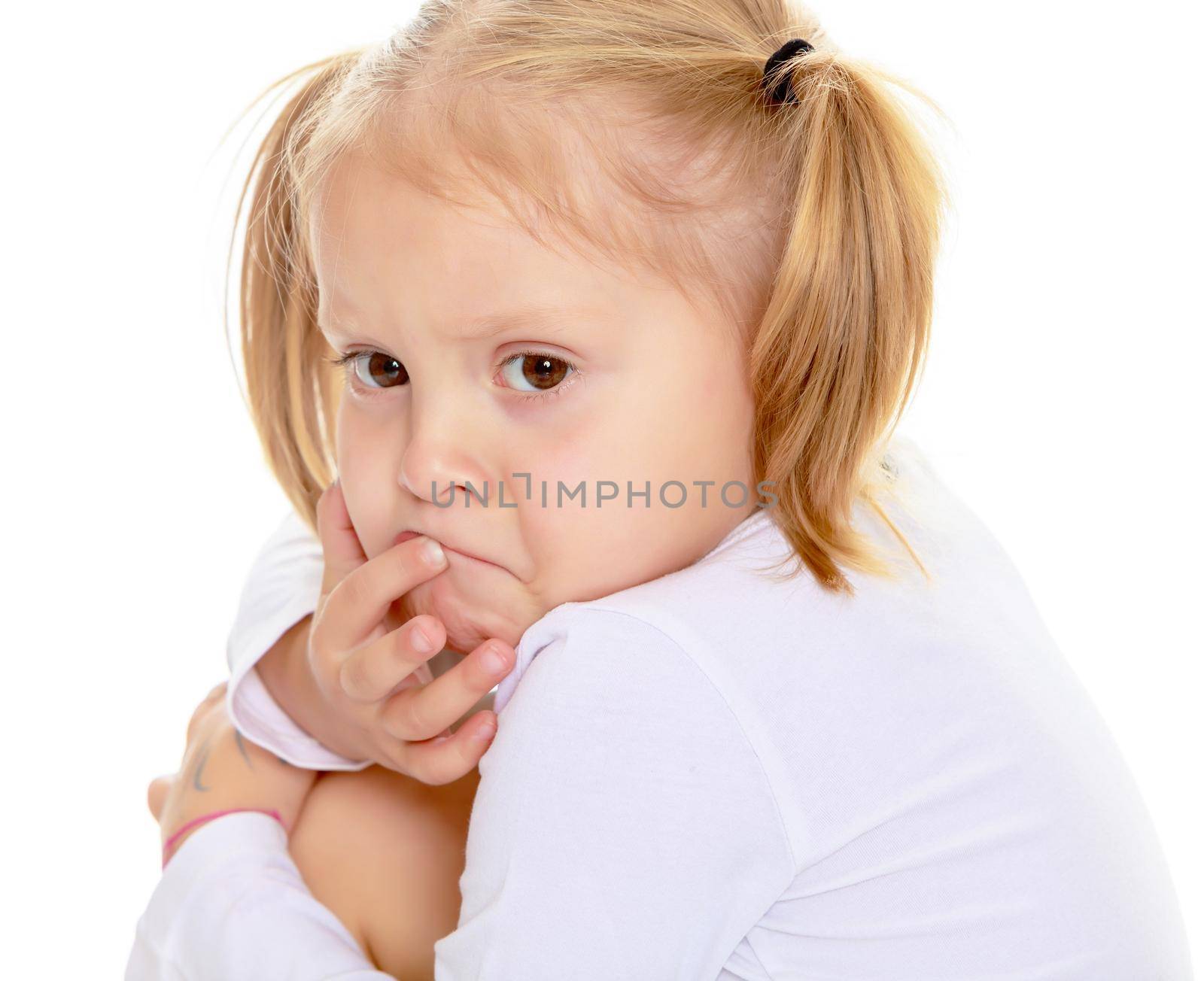 Distressed small, blonde girl with white t-shirts without a pattern.Isolated on white background
