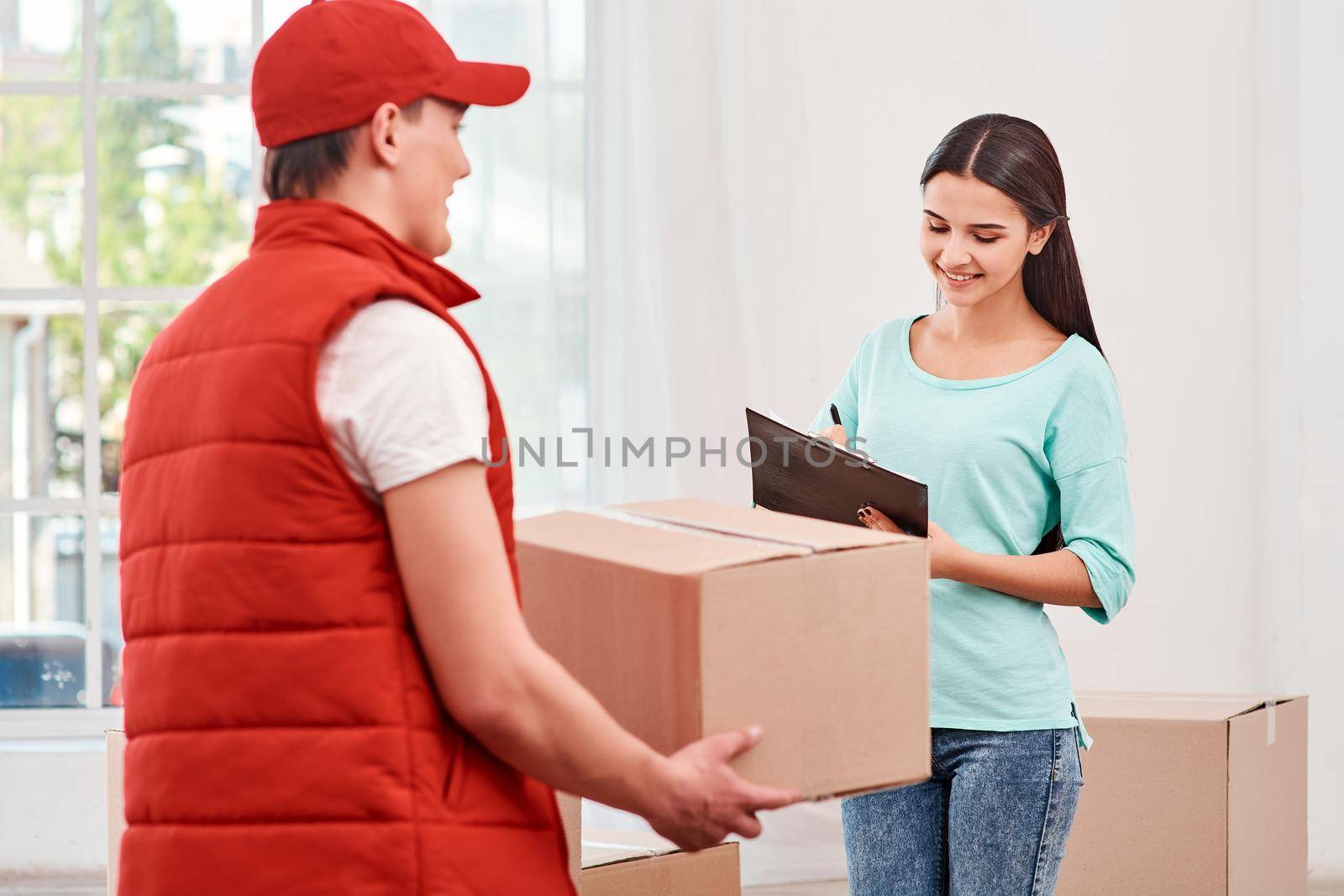 Every contact we have with a customer influences whether or not they ll come back. Woman signing receipt of delivery package. by friendsstock