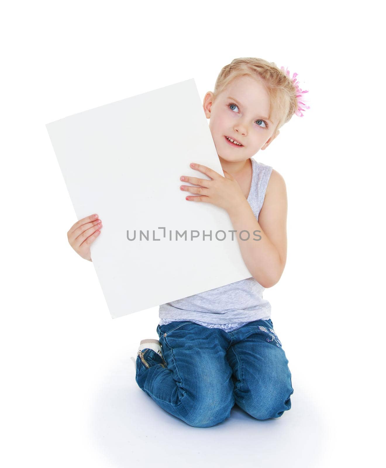 Girl holding white poster in front of him on which it is possible to write, nature on a white background.