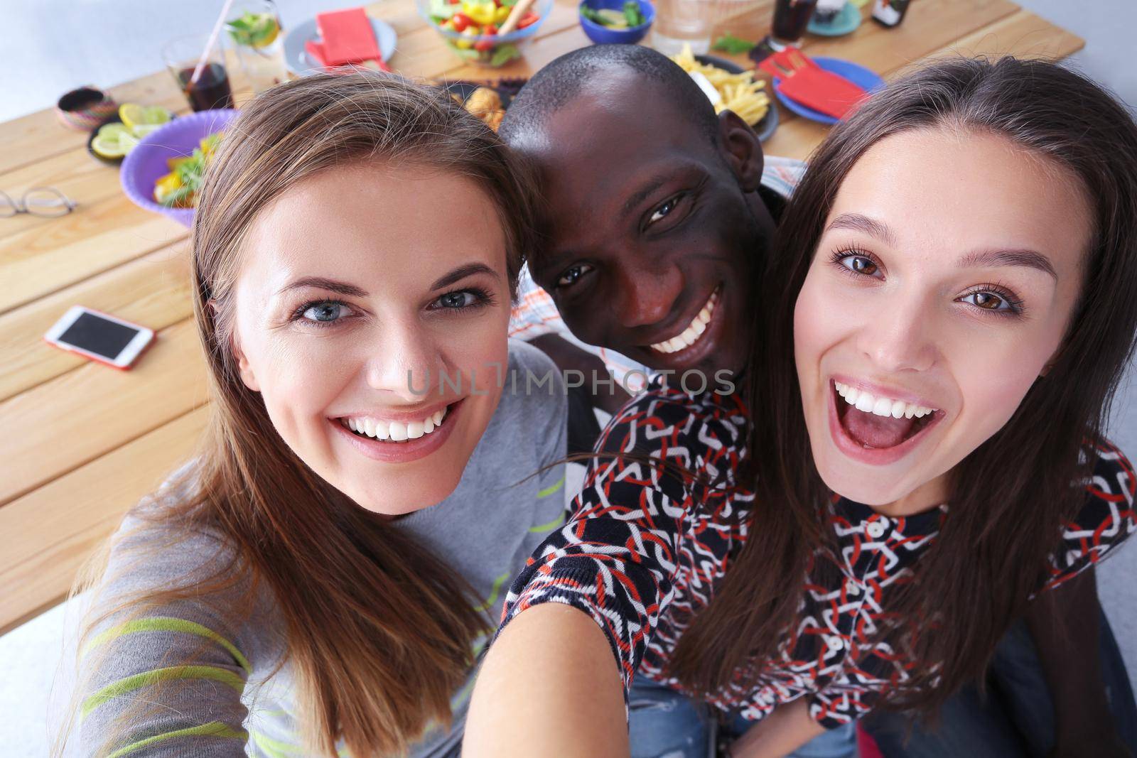 Group of people doing selfie during lunch. Self. Friends. Friends are photographed for eating by lenetstan